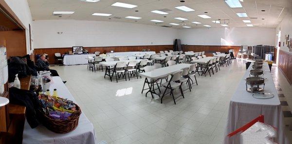 Set up for 54 with 9 tables of 6. From kitchen.