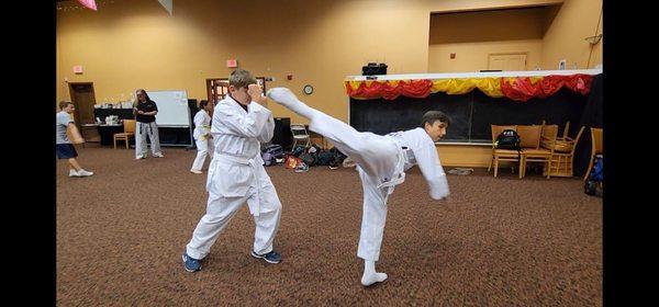 Teenagers practice sparring techniques