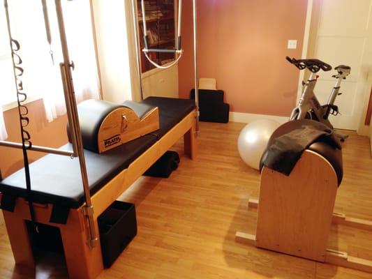 Room #2-Pilates room, equipped with Cadillac/Reformer combo, ladder barrel, spin corrector, Pilates chair. and spin bike