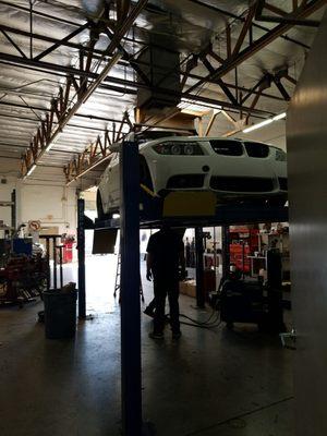 E90 up on the lift at Performance Muffler.