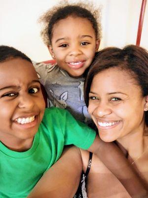 Happy client sharing her beautiful smile with her kids