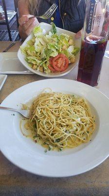 Olive oil spaghetti cesar sals and a pitcher of sangria