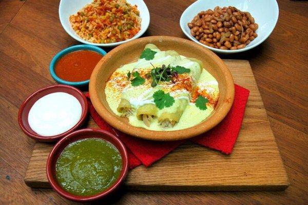 Enchiladas suizas with rice and beans, includes chips and salsa