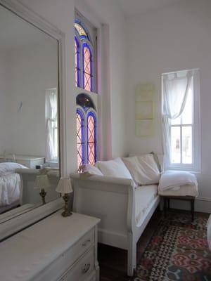 The Des Artistes Master Bedroom has a queen bed and overlooks the Courtyard Garden