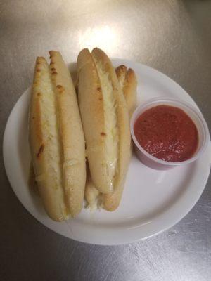 Cheese-stuffed breadsticks with pizza sauce