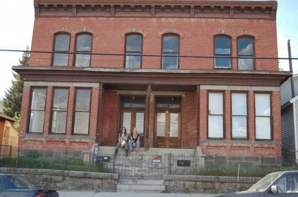 1900 Historic Montana duplex. Restoration Project. That's my sister with me!