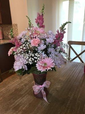 $75 arrangement - I asked for pink/purples, non-fragrant flowers, gave them a price and left the rest up to them.