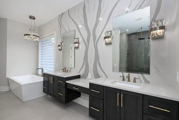 The double vanity adds a touch of luxury, while the captivating wall ignites your imagination.