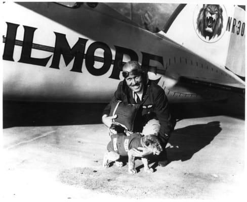 Roscoe Turner and his 3 week old lion cub, Gilmore, with his parachute