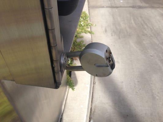 This big stiff lock will scratch your car when you drive close enough to punch in your car wash code.