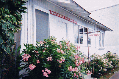 Our office is a white house with a green roof in Moiliili right across the street from Washington Middle School.