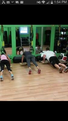 Balance board pushups between trx strap sets!