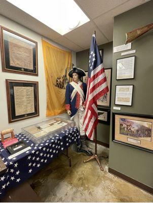 Revolutionary War display with American Flag