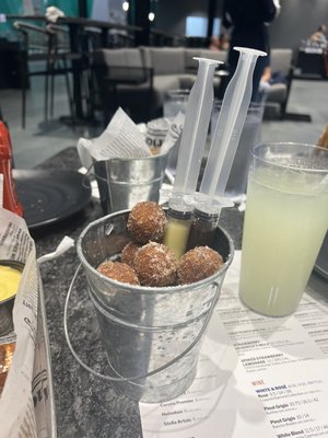 Fresh donut holes (choice of two injectable sauces: Bavarian cream, chocolate, or raspberry)