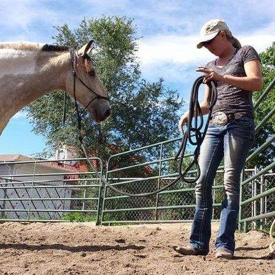 Our Trainer, Brittnee, working with a horse.