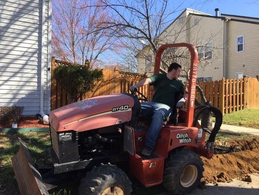 Trenching for underground wire installation