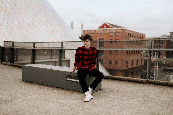 Male senior photoshoot in downtown Tacoma at the Glass Museum.