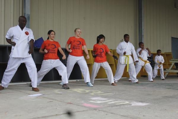 UF Gator karate club and Moring-San Martial Arts preparing for a demonstration at the annual kids kicking cancer event.