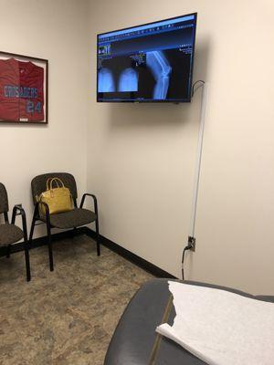 Exam room with flatscreen showing x-rays