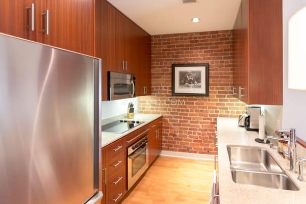 Kitchen - Notice the large amount of brick in the walls. - 333 Grant Ave San Francisco-    ReLISTO.com-  Rental Properties