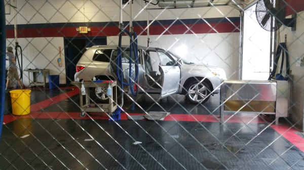 Car being hand cleaned.