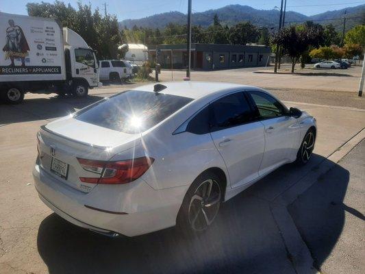 A nice pearl white car tinted by tintpros