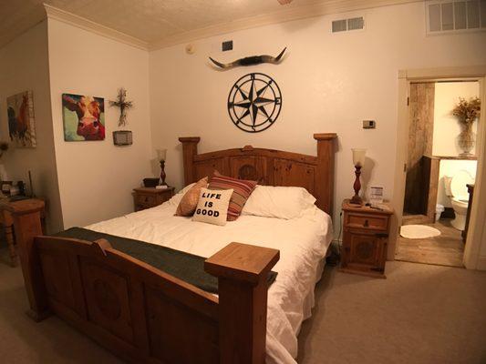 The Ranch Room has big Texas Furniture and a walk-in shower.