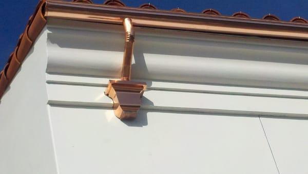 Copper 6" half round gutter with leader head.