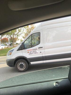 This driver for orange courier cut me off and almost caused a collision.