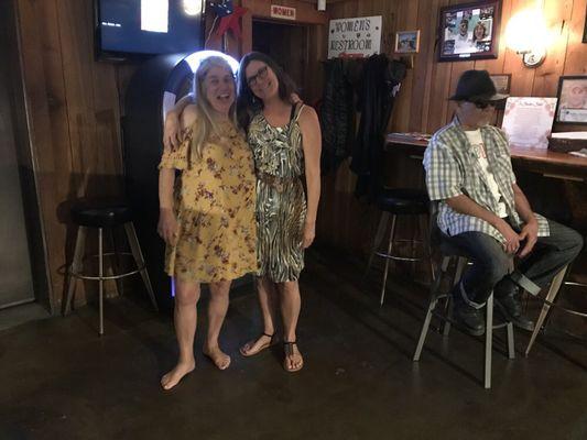 The girls playing the jukebox