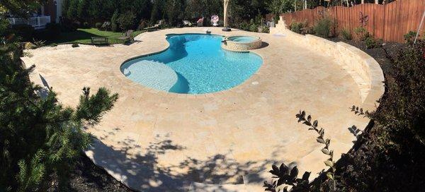 Pool deck , natural stone travertine.