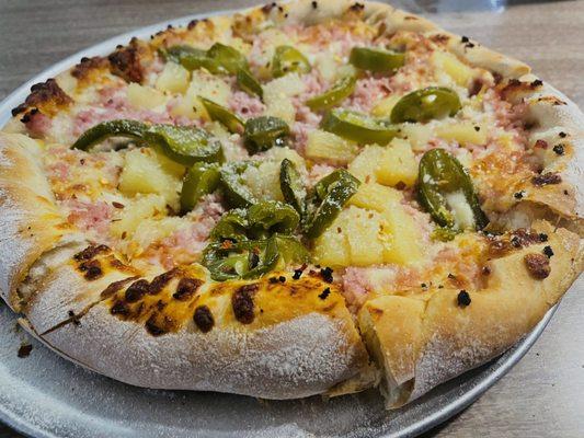 Small pineapple, ham, and jalapeño pizza