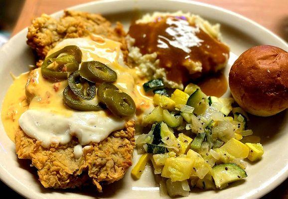 Chicken fried steak with gravy and queso