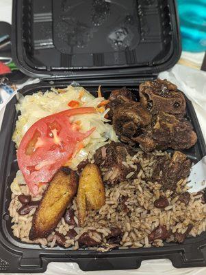 Oxtail, rice & peas, plantain, cabbage, & tomato slice. This is after I took a couple bites. I could not wait!