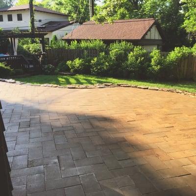 This herringbone  patterned paver patio extends the living space outdoors!