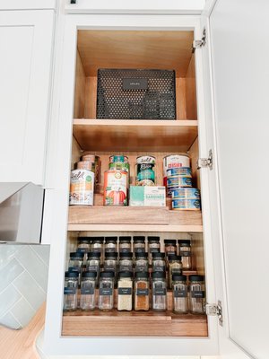 Kitchen cabinet organization - decanted spices and canned goods