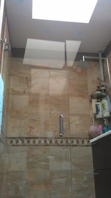 Finished work- shower tiles, installed shower glass doors