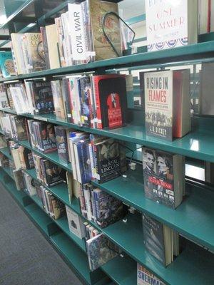 The section on The Civil War back to Jamestown ; some books covers are displayed , hiding the fact that the shelves are substantially empty