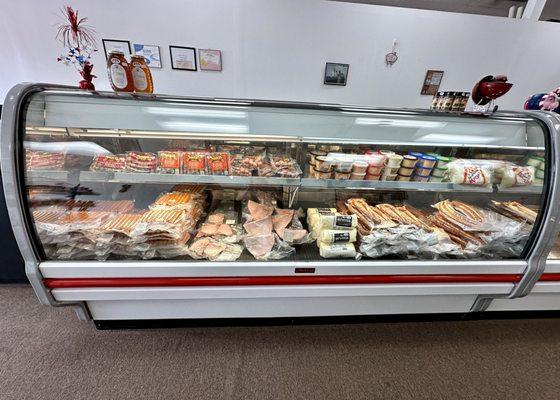 Display case of hotdogs, kielbasa, etc.