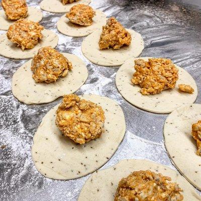 Wolfski's buffalo chicken pierogi being made by hand.