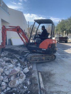 Demotion work done in downtown Austin breaking concrete with skid steer and mini excavator.