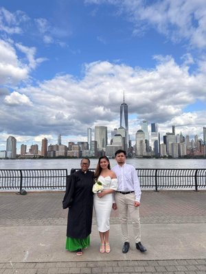 Waterfront wedding with NYC in background.