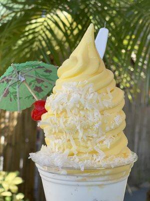 Pineapple Dole sundae.  Pineapple dole whip  Toasted coconut  Cake