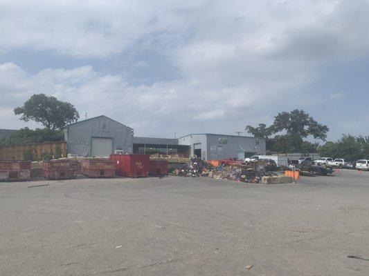 Wide shot of the facility and aluminum/wire collections.