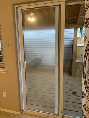 Sliding door with broken seal and fogged glass