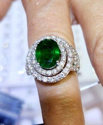 Gorgeous emerald white gold ring with diamond detailing.