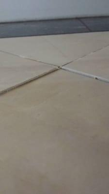 Once there is no grout left, the tiles started shifting in every direction possible.