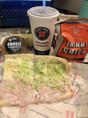 Delicious Turkey sandwich with chips, oatmeal cookie, and unsweetened tea that my friend ordered delivered for me for dinner!