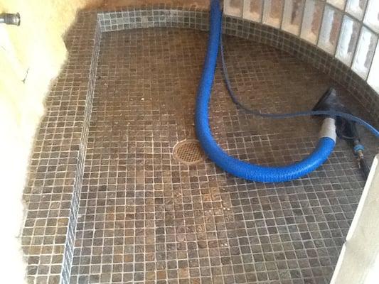 Some slate tile and grout cleaning in a 2 year old shower.