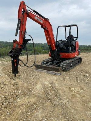 Excavator with a rock hammer